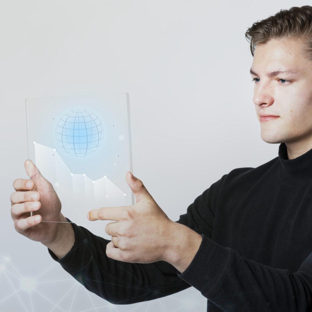 businessman holding a digital screen that generated globe
